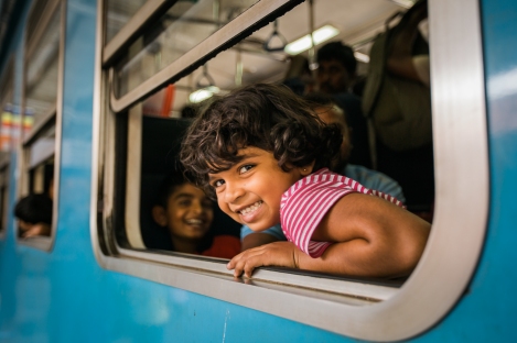 Girl Riding Train in Sri Lanka